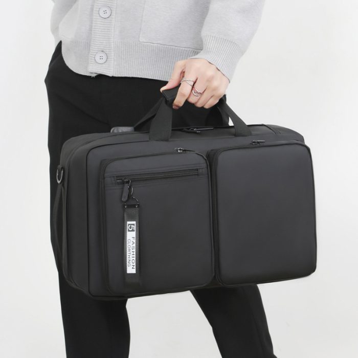 The spacious interior compartments of a large capacity commuter laptop backpack.