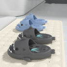 Unisex quick drying shark slippers with drain holes made of comfortable EVA foam.