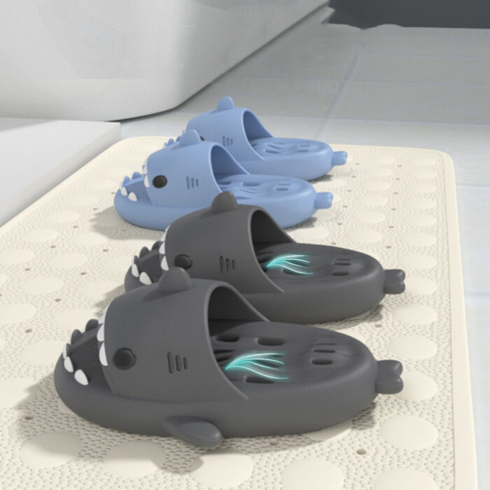 7d9f728c-2e2a-41cf-a78b-b31988226d6f.jpg Unisex quick drying shark slippers with drain holes made of comfortable EVA foam.