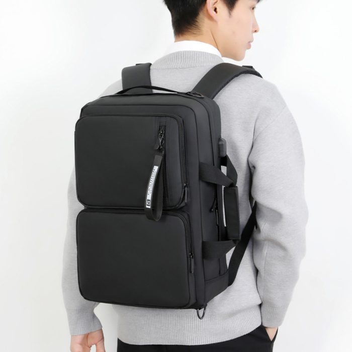 The spacious interior compartments of a large capacity commuter laptop backpack.