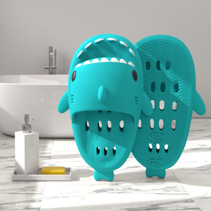b8f69096-c6a8-4348-905e-275b9c2965a5.jpg Unisex quick drying shark slippers with drain holes made of comfortable EVA foam.