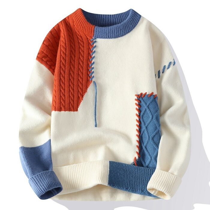 Handsome young man wearing a stylish mens colorblock pullover sweater.