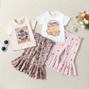 Cute toddler girl smiling and wearing a trendy toddler girl bell bottom outfit with a floral print.