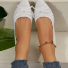 Women's knitted pointed-toe loafers with a stylish bow, perfect as comfortable office shoes for women.
