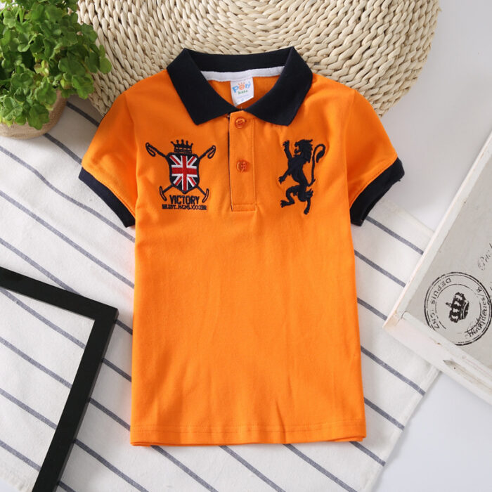 Young boy wearing a comfortable Boys Classic Short Sleeve Polo Shirt.