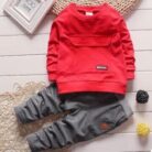 Active toddler playing happily in a comfortable toddler terno set.