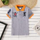 Young boy wearing a comfortable Boys Classic Short Sleeve Polo Shirt.