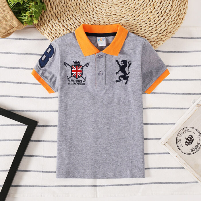 Young boy wearing a comfortable Boys Classic Short Sleeve Polo Shirt.