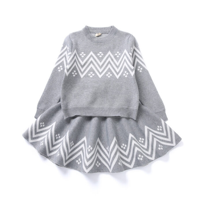 Young girl smiling in a stylish and comfortable girls long sleeve skirt set.