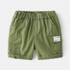 Young boy playing outdoors wearing comfortable boys cotton summer shorts.