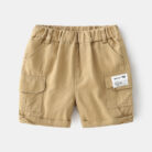 Young boy playing outdoors wearing comfortable boys cotton summer shorts.