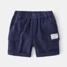 Young boy playing outdoors wearing comfortable boys cotton summer shorts.
