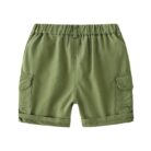 Young boy playing outdoors wearing comfortable boys cotton summer shorts.