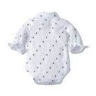 Handsome little boy wearing a stylish boys formal suspender terno set.