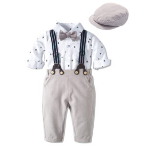 Handsome little boy wearing a stylish boys formal suspender terno set.