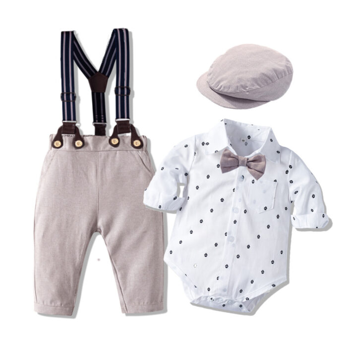Handsome little boy wearing a stylish boys formal suspender terno set.