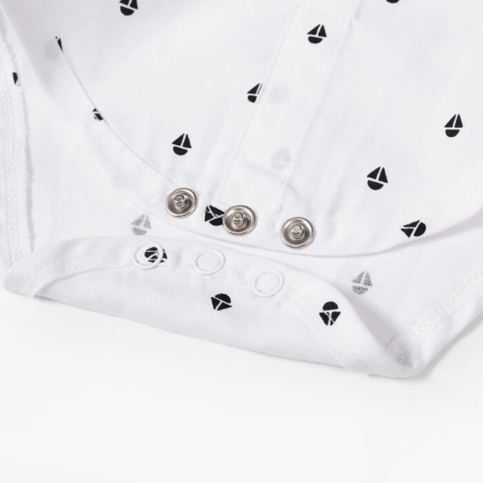 Handsome little boy wearing a stylish boys formal suspender terno set.