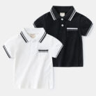 Young boy smiling outdoors wearing a comfortable boys short sleeve summer polo.