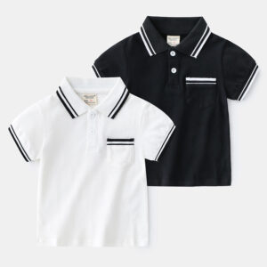 Young boy smiling outdoors wearing a comfortable boys short sleeve summer polo.