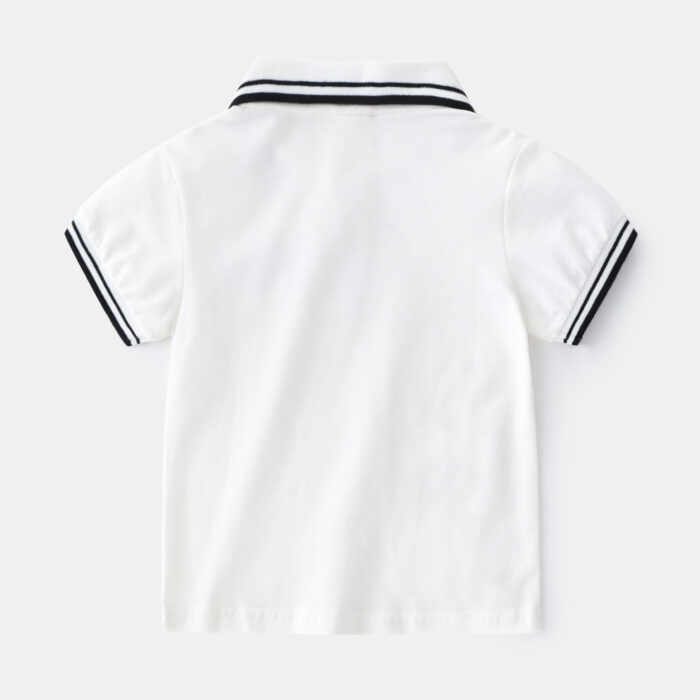 1623402244151.jpg Young boy smiling outdoors wearing a comfortable boys short sleeve summer polo.
