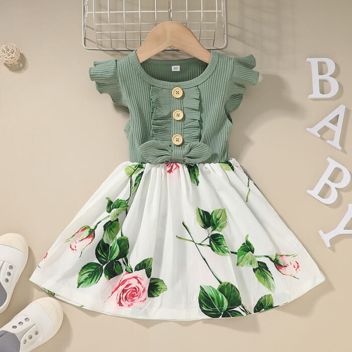 Cute toddler girl wearing a comfortable and colorful toddler girls summer dress outdoors.