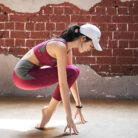 Woman wearing a premium 2-piece matching workout set and breathable sportswear, perfect for gym fitness