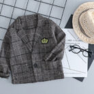 Handsome toddler boy dressed in a stylish boys 3 piece formal terno.