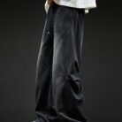 Stylish young man wearing trendy mens wide leg denim cargo pants.