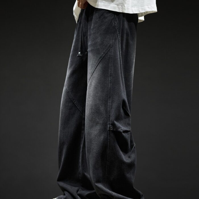 Stylish young man wearing trendy mens wide leg denim cargo pants.