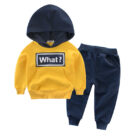 Young child smiling and playing in a comfortable kids cotton two piece set.