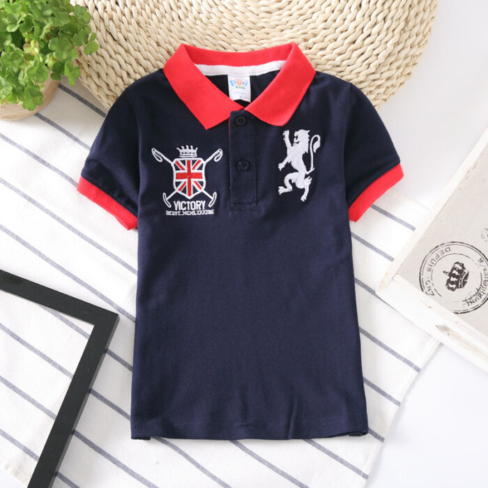 Young boy wearing a comfortable Boys Classic Short Sleeve Polo Shirt.