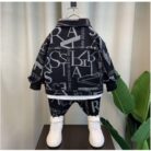 Handsome little boy wearing a stylish boys casual denim terno set.