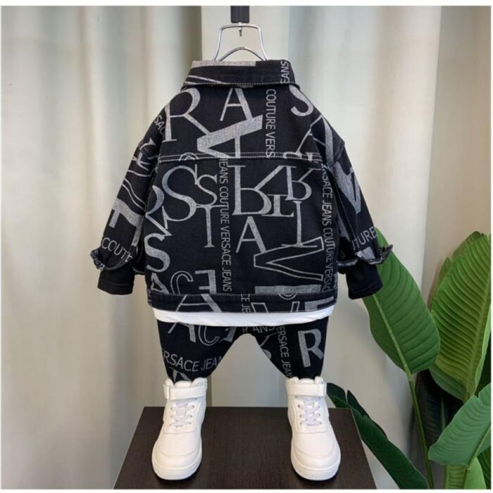 Handsome little boy wearing a stylish boys casual denim terno set.