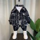 Handsome little boy wearing a stylish boys casual denim terno set.