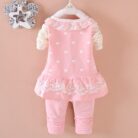 Cute toddler girl smiling in a comfortable toddler girl tracksuit set.
