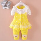 Cute toddler girl smiling in a comfortable toddler girl tracksuit set.