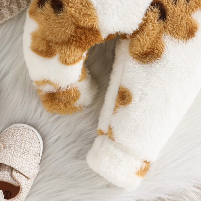 Adorable baby wearing a cozy milky white baby bear velvet terno set.