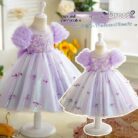 Happy little girl twirling in a beautiful girls short sleeve princess dress.