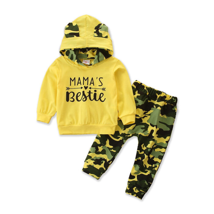 3eb55ebd-8d81-4667-835e-1e96a515b7fe.jpg Stylish toddler girl smiling outdoors in a trendy pink toddler girl camo outfit.
