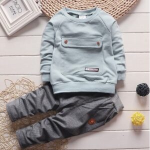 Active toddler playing happily in a comfortable toddler terno set.