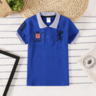 Young boy wearing a comfortable Boys Classic Short Sleeve Polo Shirt.