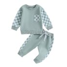 Stylish toddler boy wearing a cool boys checkered sweater terno set.