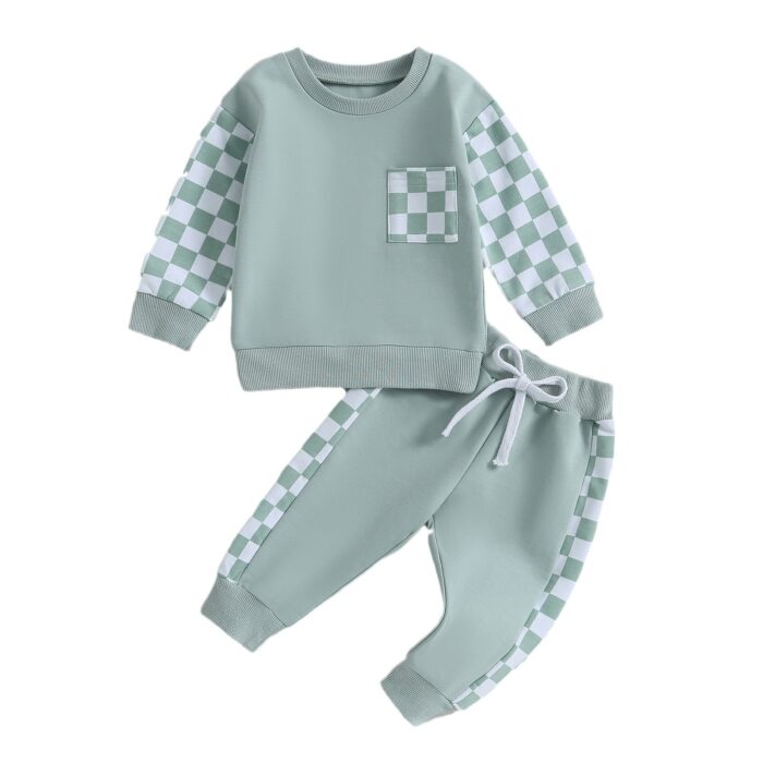 Stylish toddler boy wearing a cool boys checkered sweater terno set.