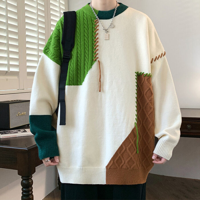 Handsome young man wearing a stylish mens colorblock pullover sweater.