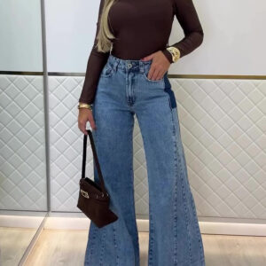Woman wearing stylish women's high waisted flare jeans in a light blue wash.