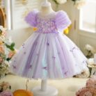 Happy little girl twirling in a beautiful girls short sleeve princess dress.