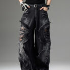 Young man wearing stylish black mens vintage distressed drawstring jeans.