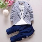 Active toddler playing happily in a comfortable toddler terno set.