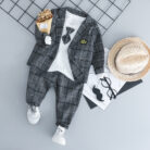 Handsome toddler boy dressed in a stylish boys 3 piece formal terno.