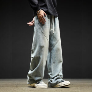 Stylish young man wearing trendy mens wide leg denim cargo pants.